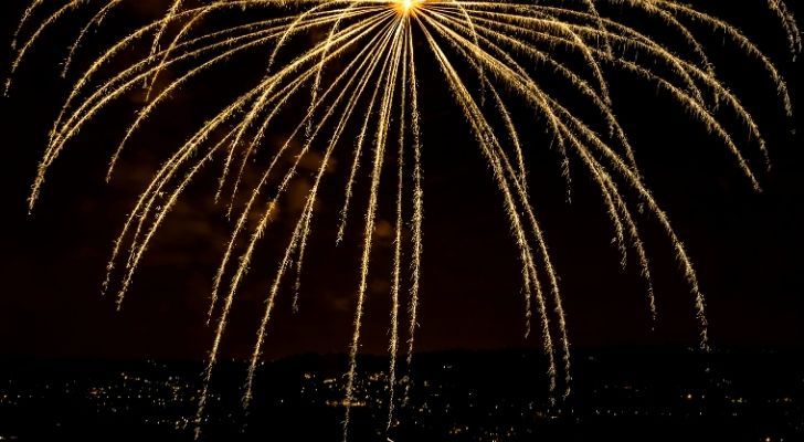 A golden firework showering the night sky