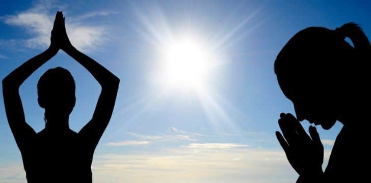 Image of a man meditating and a woman praying.