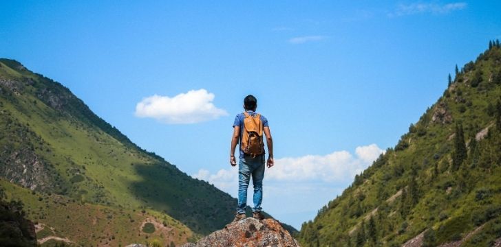 A man hiking a wild valley