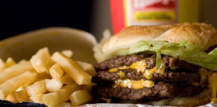 A delicious Wendy's meal with a burger, french fries and a soda