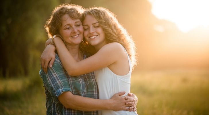 Two women hugging and smiling