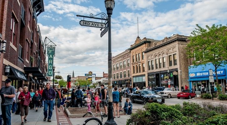 People walking through a town in North Dakota