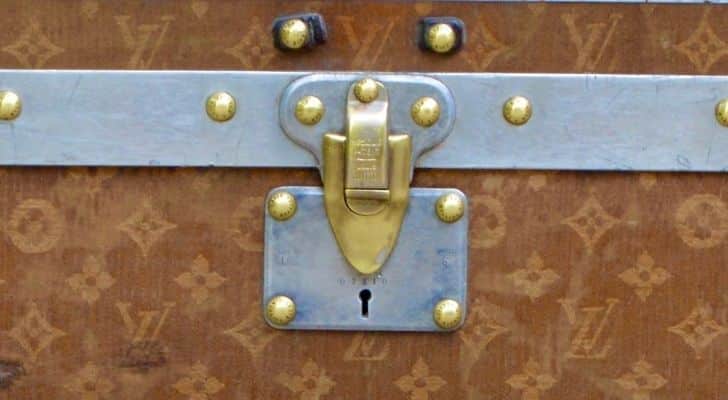 A closeup of a Louis Vuitton trunk lock