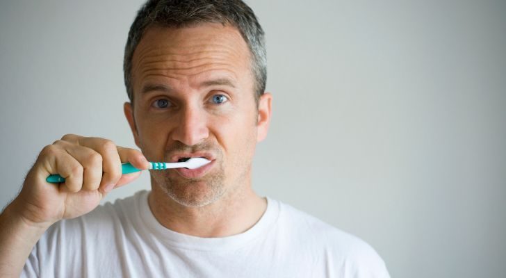 A man brushing his teeth