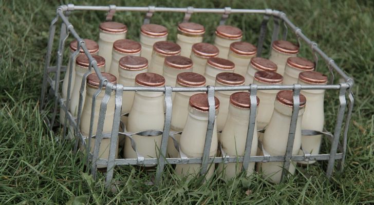 A crate of classic milk glass bottles