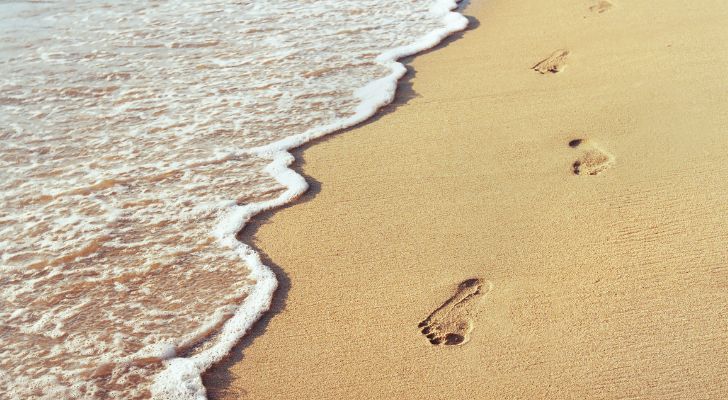 Footprints in the sand on a beach