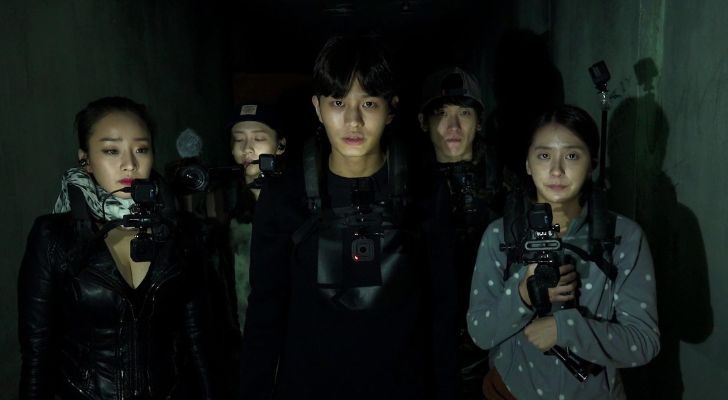 A group of Korean friends gather in the dark