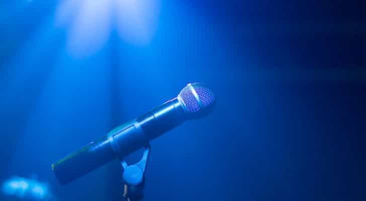 A microphone on stage ready to be sung into