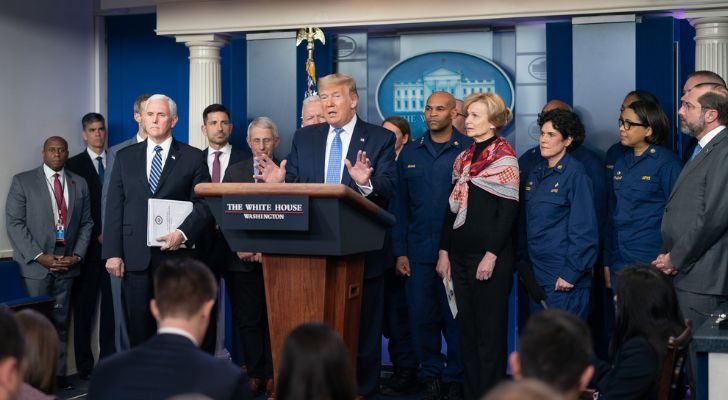 Trump conducting a COVID-19 press briefing with members of the press