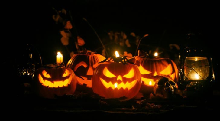 A collection of Jack O'Lanterns with various faces carved into them