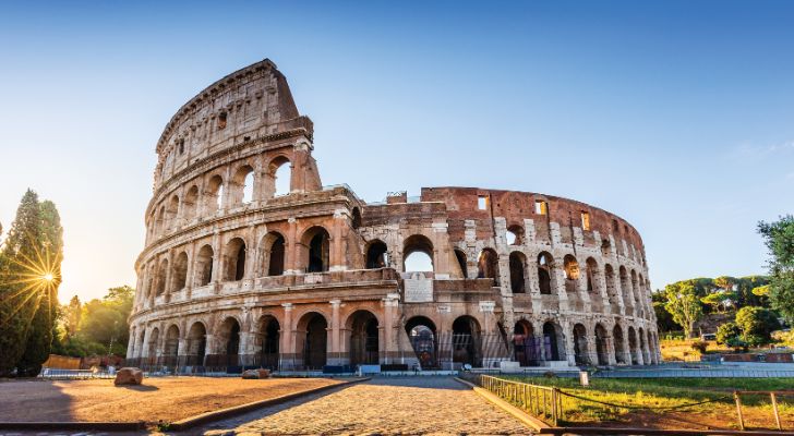 Rome's Colosseum as the sun begins to rise over the city