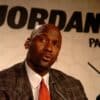 Michael Jordan speaking at a press event with "Jordan Paris 06" logo in the background