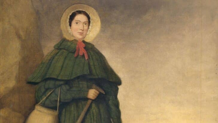 Illustration of Mary Anning holding a fossil hammer, wearing period clothing with a bonnet