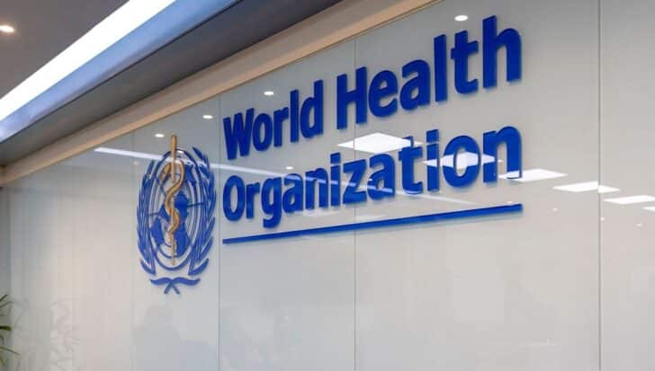 World Health Organization logo on a glass wall