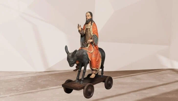 A statue depicting a Jesus riding a donkey on Palm Sunday, located at The Metropolitan Museum of Arts