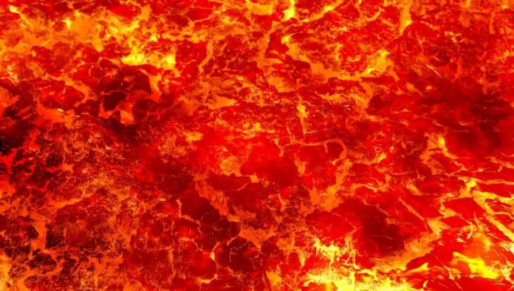 Close-up view of bright red and orange molten lava flow.