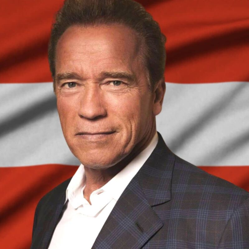 Arnold Schwarzenegger in front of the Austrian flag