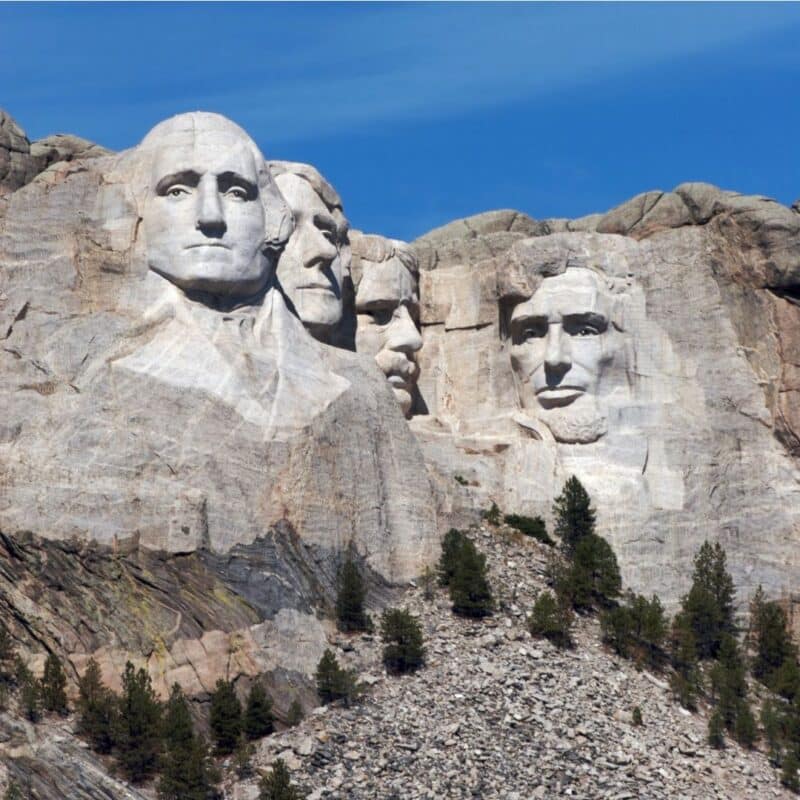 Mount Rushmore featuring the carved faces of George Washington, Thomas Jefferson, Theodore Roosevelt, and Abraham Lincoln