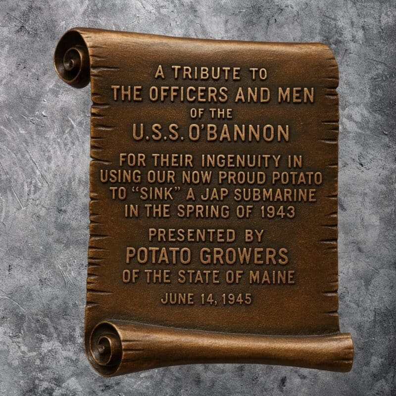 Bronze scroll plaque honoring USS O’Bannon officers and crew for using potatoes to help sink a Japanese submarine in 1943, presented by Maine potato growers