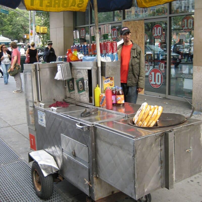 A hot dog cart vendor near Central Park
