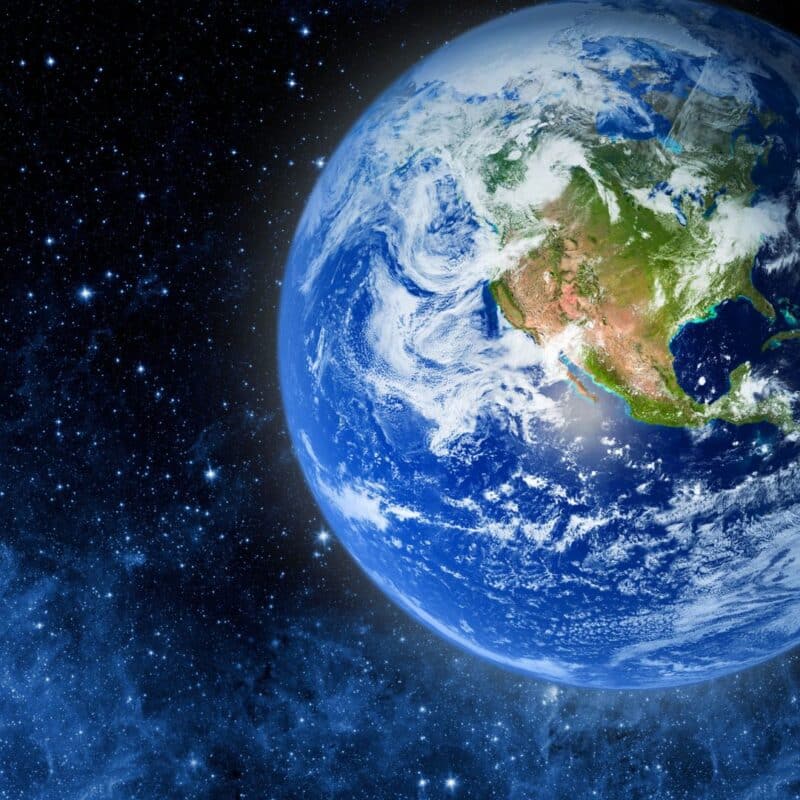 Earth viewed from space, with visible landmasses and swirling clouds