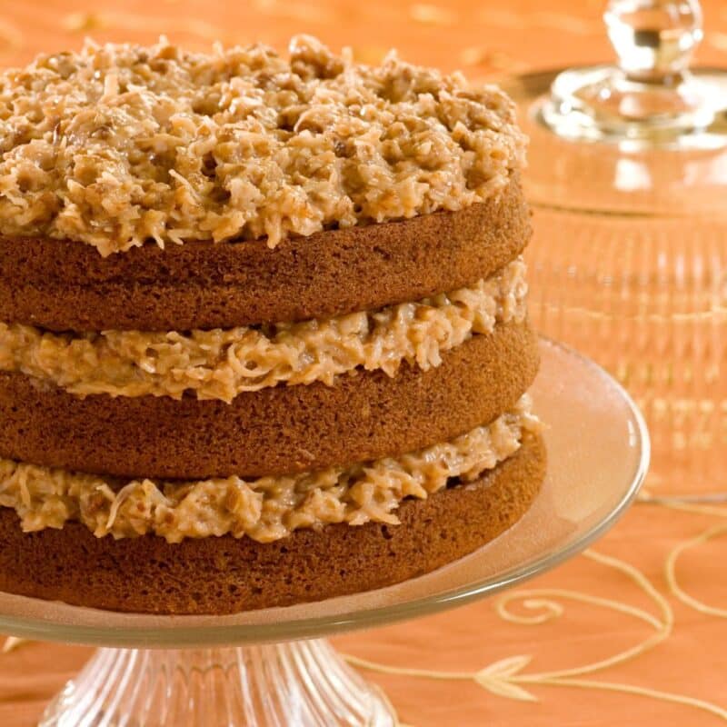A layered German chocolate cake with coconut-pecan frosting