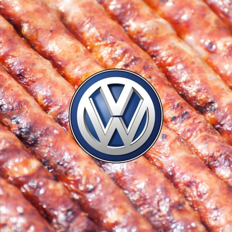 Grilled sausages with the Volkswagen logo overlaid