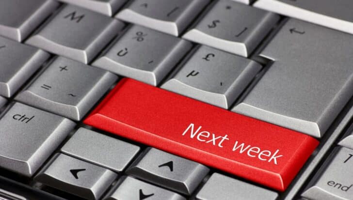 A computer keyboard with a red key labeled 'Next week' 
