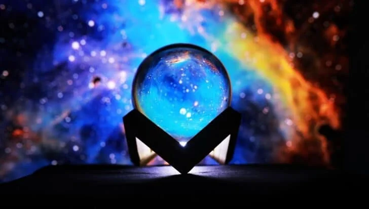 A crystal ball with a cosmic background implying psychic or mystical themes related to CIA's attempts at training psychic spies